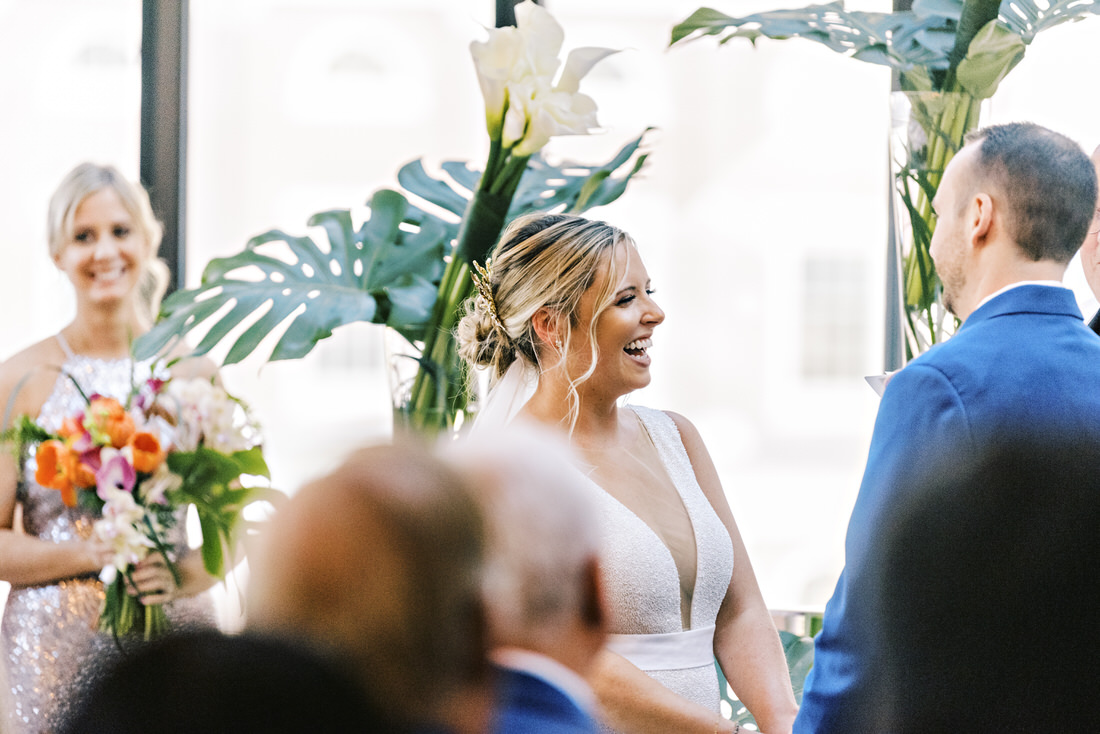 Bride smiling and laughing during wedding ceremony