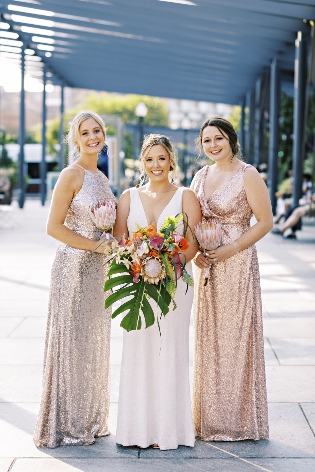 Bride and bridesmaids pose for photo at the Rose Kennedy Greenway