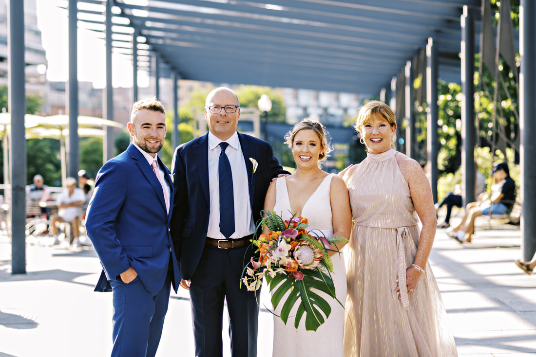 Bride and her family poses for a photo at the Rose Kennedy Greenway