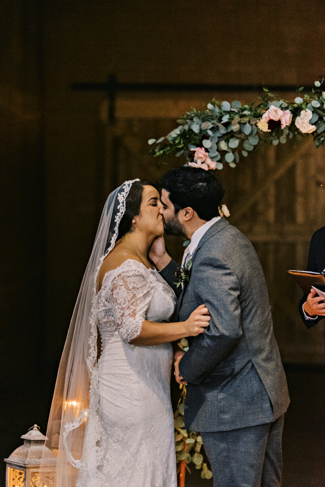 Bride and groom kissing for the first time as husband and wife