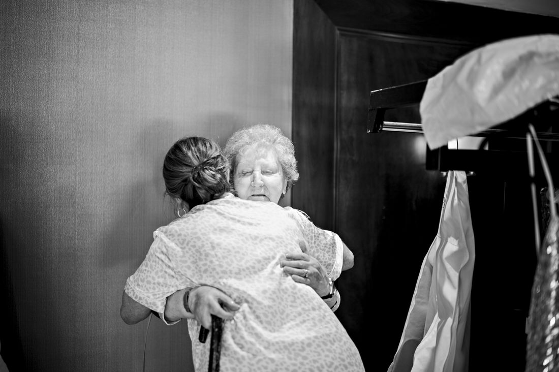 Grandmother and granddaughter hugging on granddaughter's wedding day