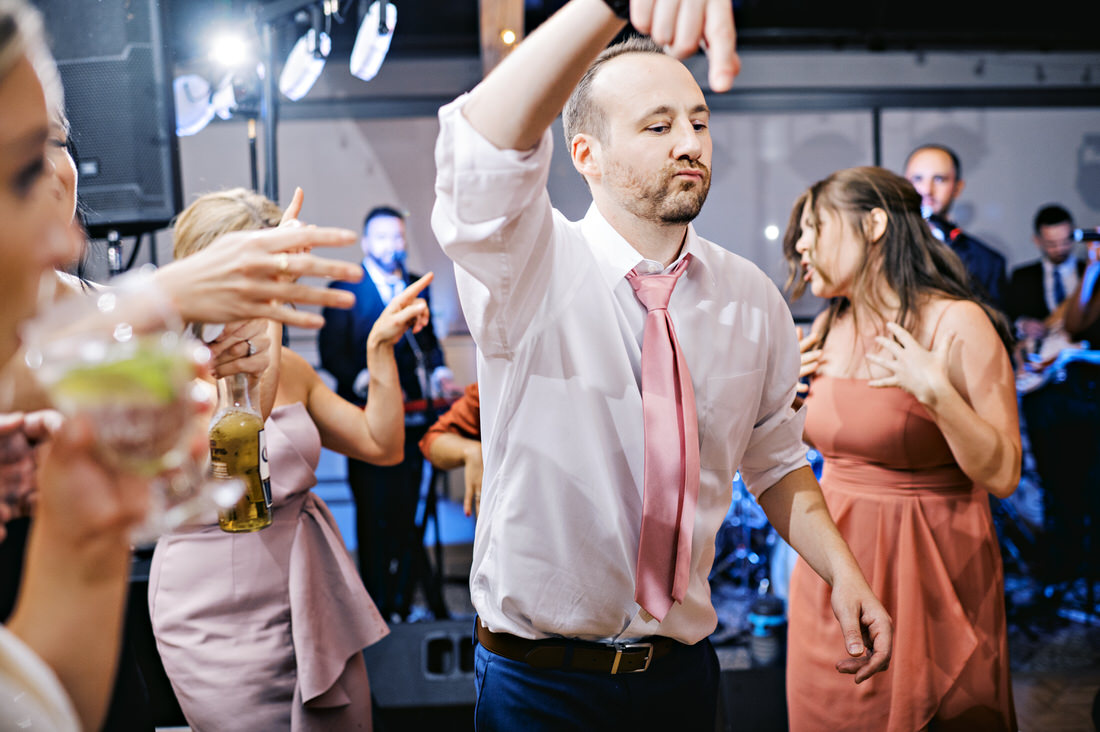 Groom dancing at his wedding reception at the Bostonian