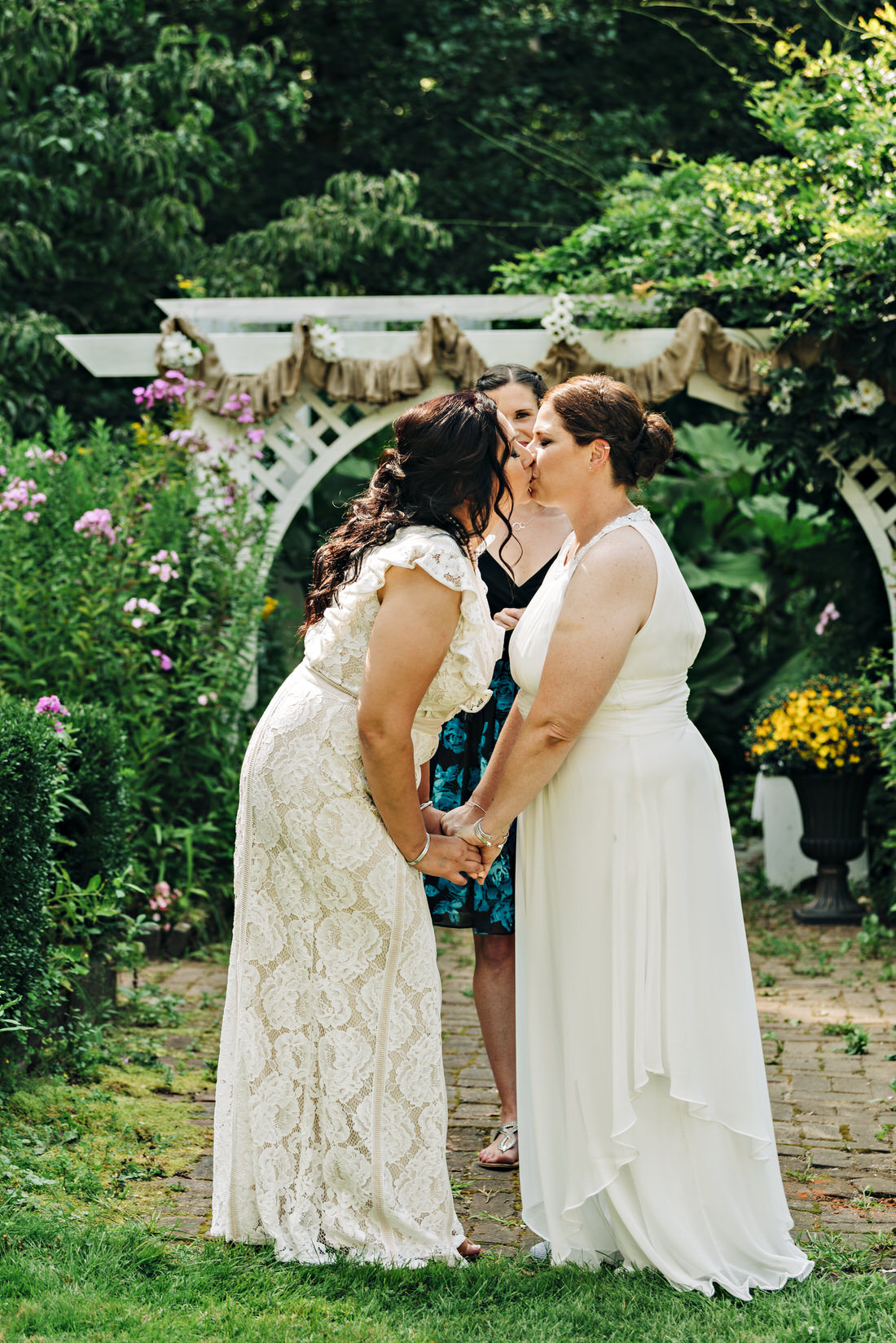 Brides first kiss as wives