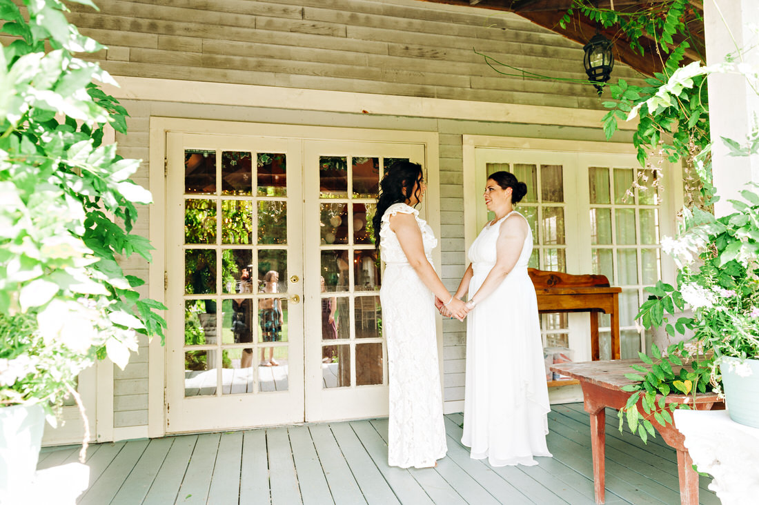 Brides first look at on the porch at Hartmans Herb Farm