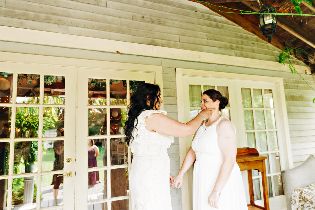 Brides seeing one another during their first look