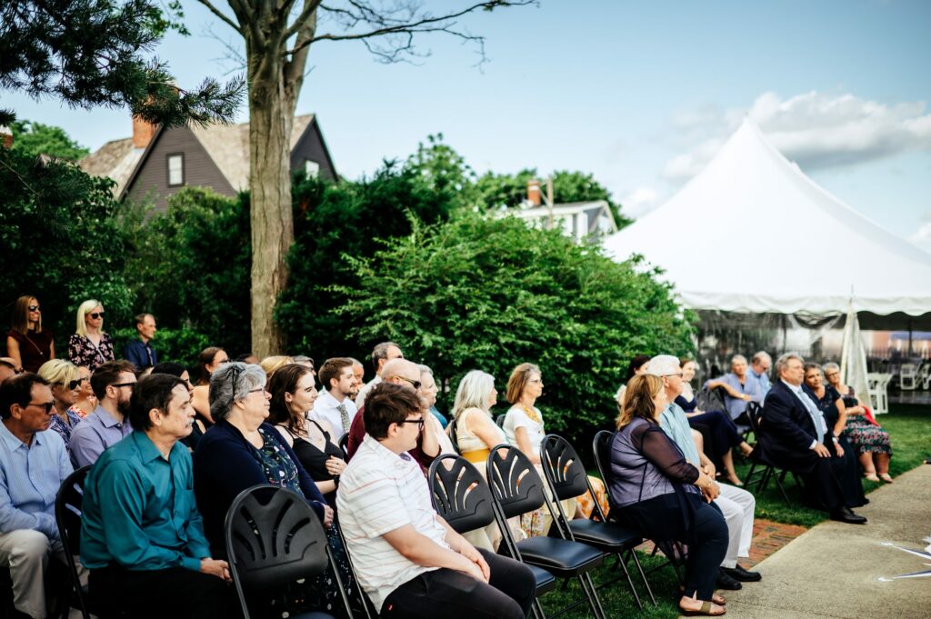 Guests seated during outdoor waterfront ceremony at The House of Seven Gables 