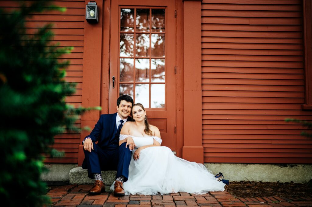 Bride and groom portrait taking in the garden of The House of Seven Gables