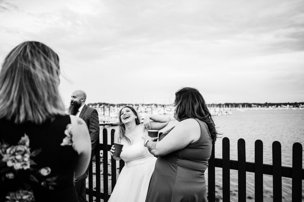 Portrait of bride laughing candidly during wedding reception in Salem, MA