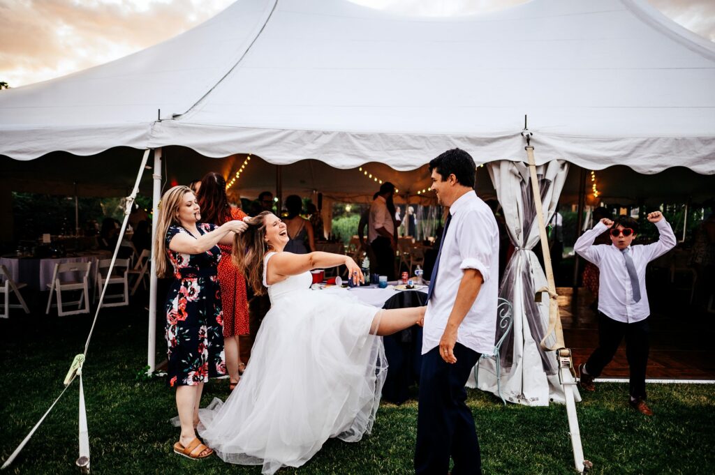 Candid shot during wedding reception at the House of Seven Gables 