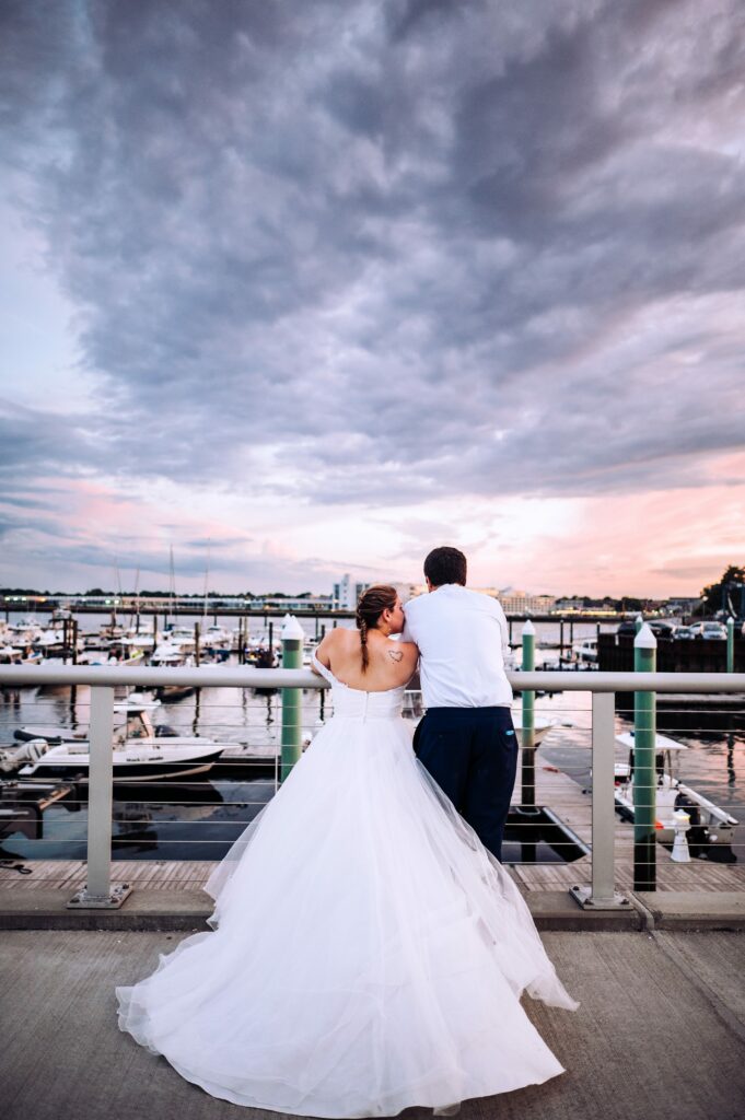 Sunset portraits of bride and groom overlooking Salem Harbor 