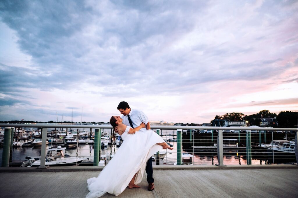 Sunset portraits of bride and groom overlooking Salem Harbor 