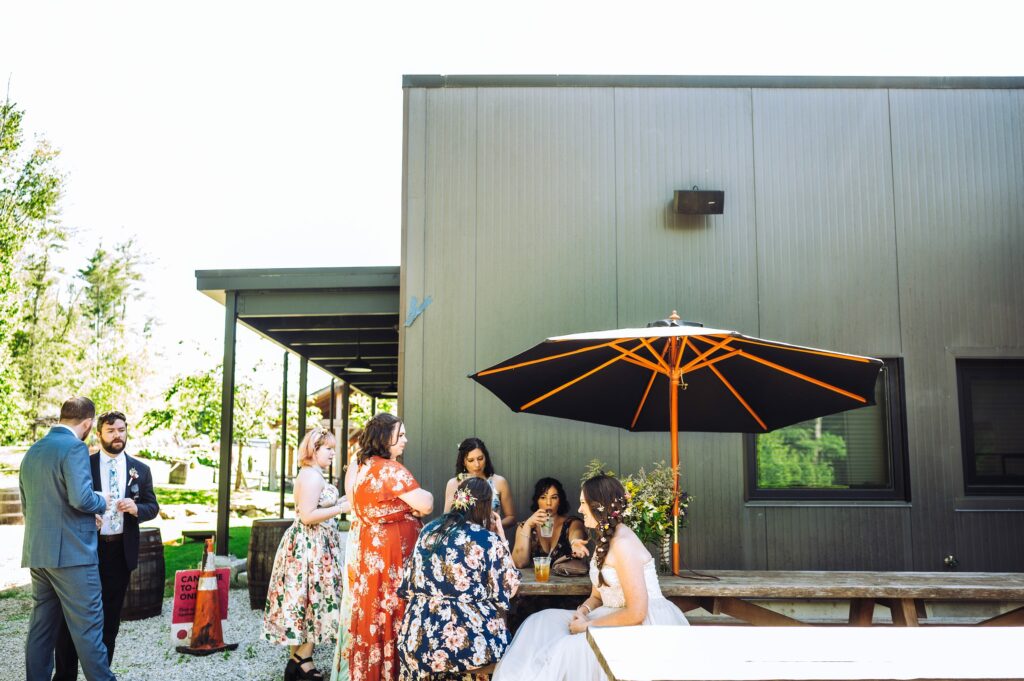 Bride and friends outside at Tree House Brewing Co.