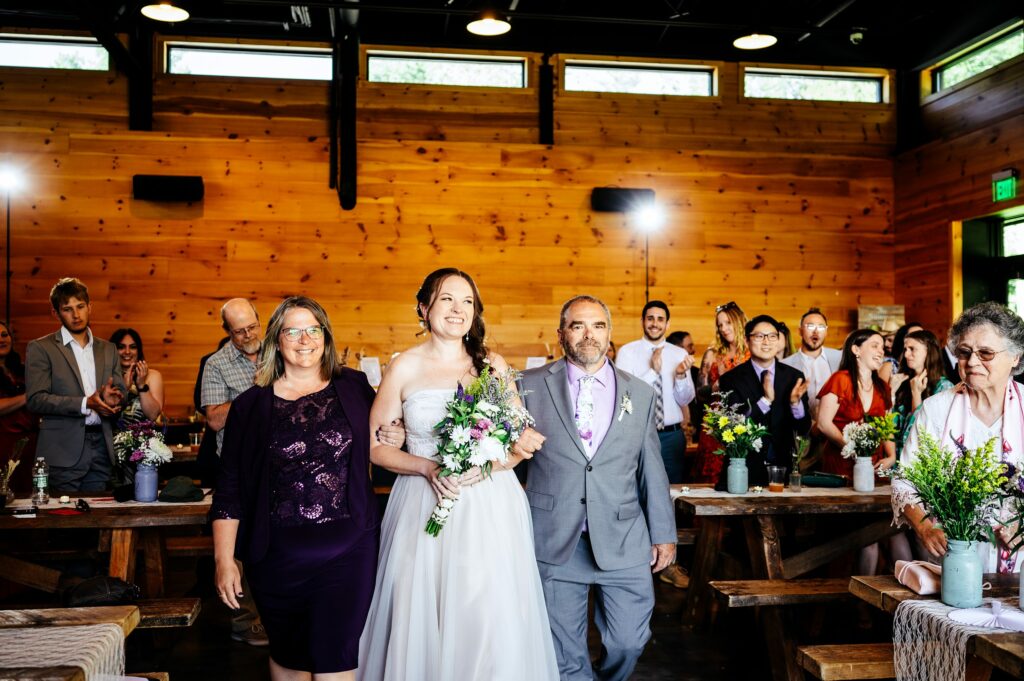 Bride walking down the aisle at Tree House Brewing Co.