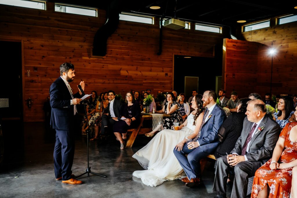 Bride and groom faces during toasts