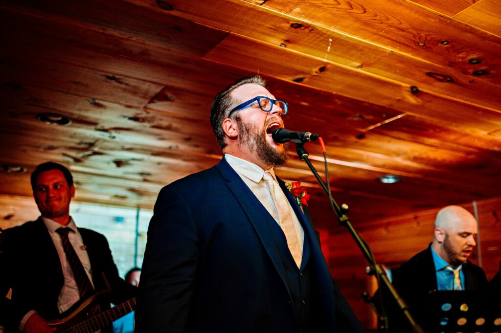 Groom plays during reception with his band