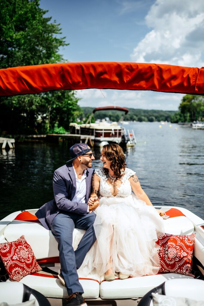 Couple sitting on their boat during wedding portraits