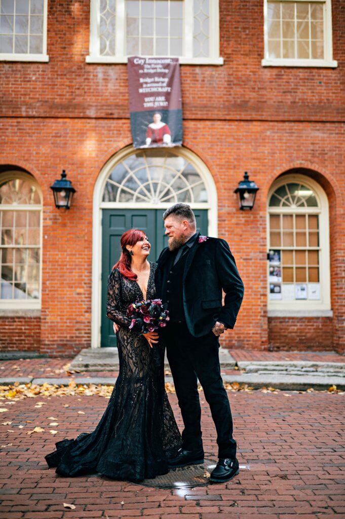 Salem elopement portrait taken downtown with bride and groom wearing all black