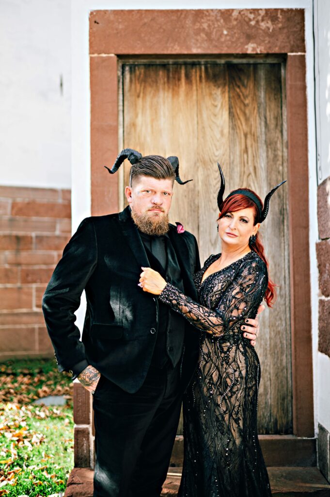 Bride and groom dressed in all black for Halloween elopement 