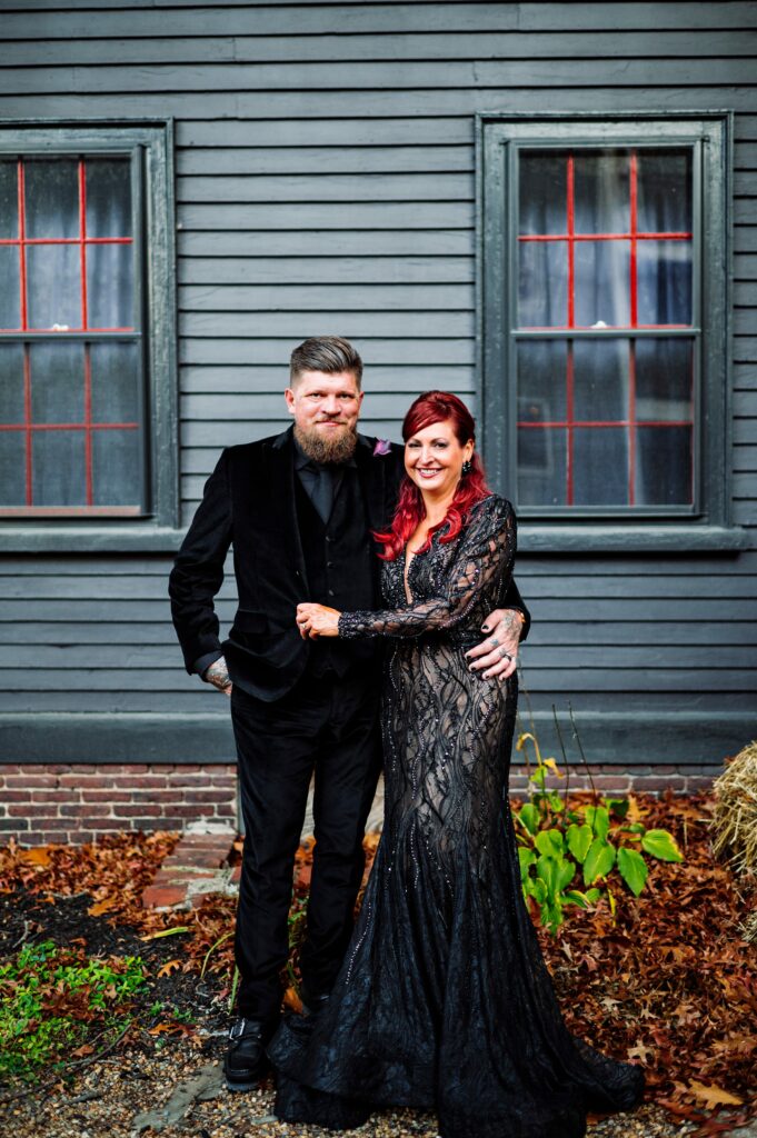 Bride and groom portrait in Salem dressed in all black for Halloween