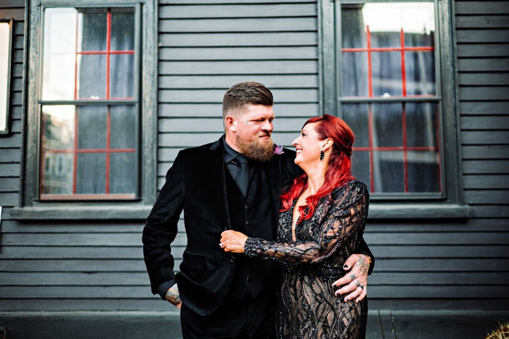 Bride and groom portrait in Salem dressed in all black for Halloween