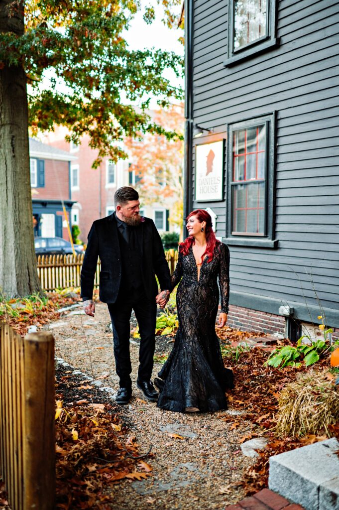 Bride and groom portrait in Salem dressed in all black for Halloween