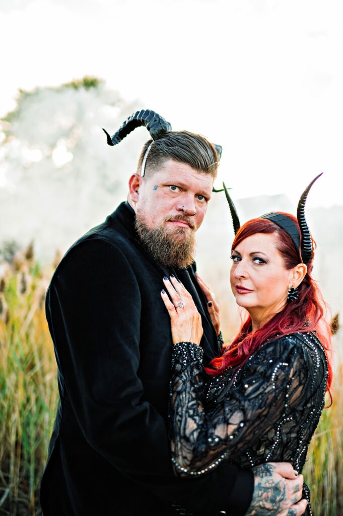 Bride and groom portrait in Salem dressed in all black for Halloween