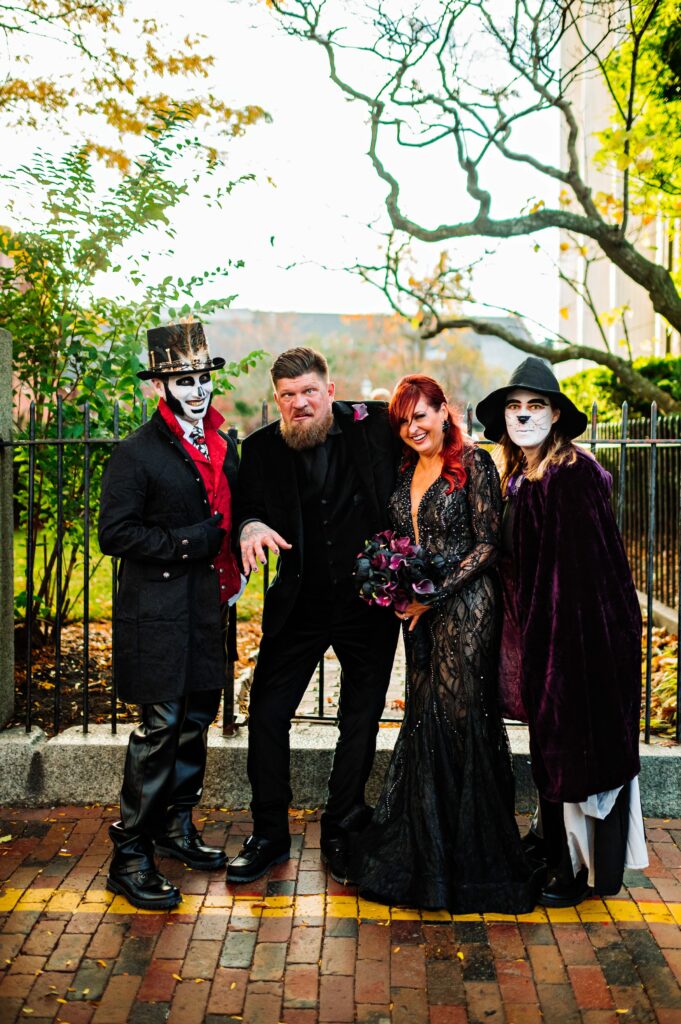 Bride and groom with their friends dressed in costume for Halloween elopement 