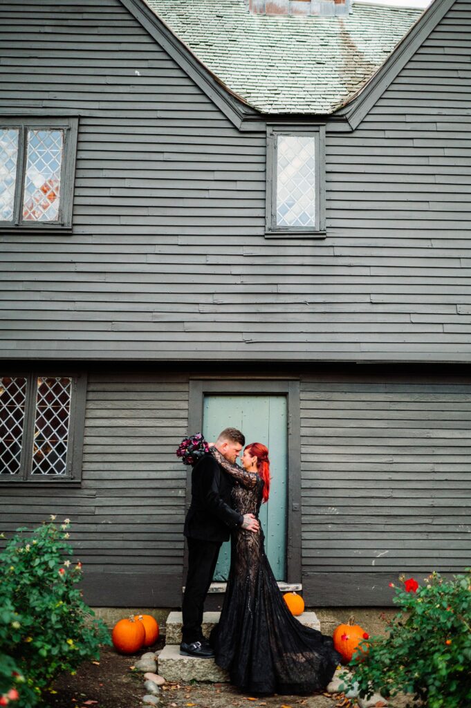 Bride and groom portrait in Salem dressed in all black for Halloween