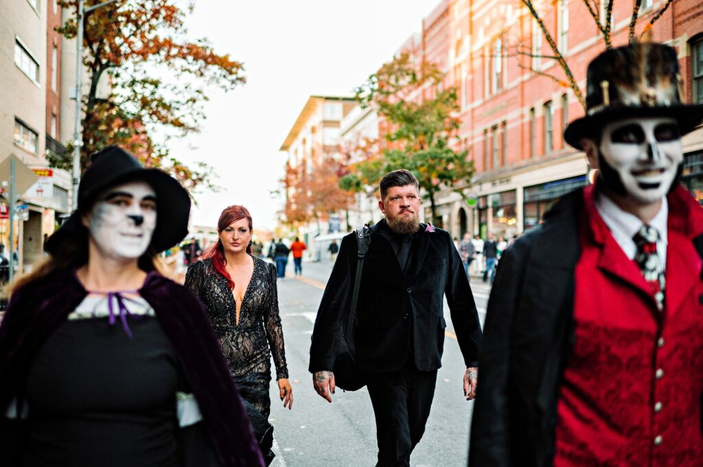 Candid photo of bride and groom walking through the streets of Salem