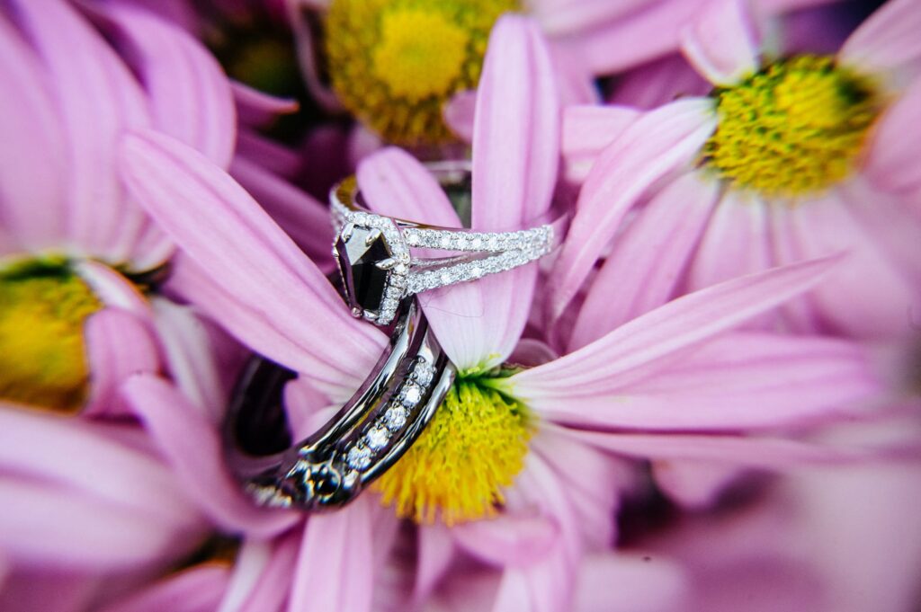 Engagement Rings detail photography on a flower