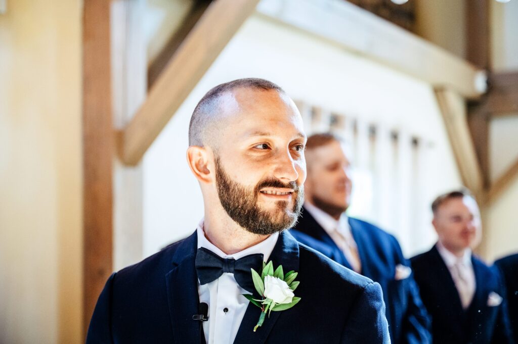 Groom seeing bride walk down the aisle 