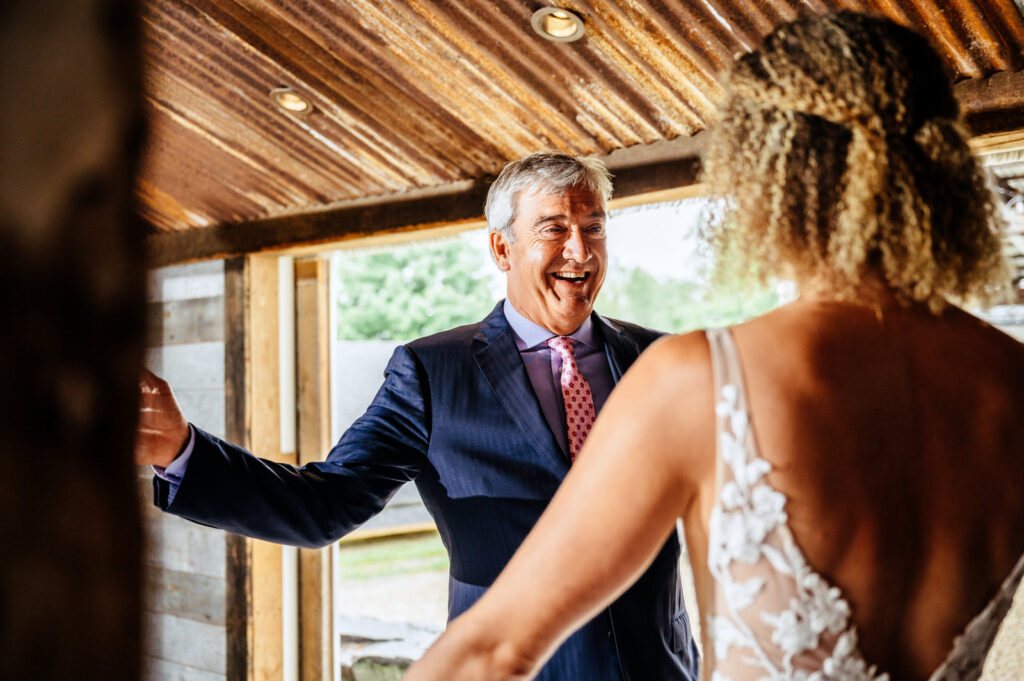 Bride and her father first look in the Barn at South Farms