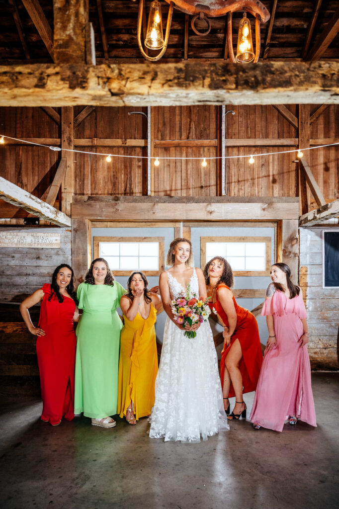 Bride and her bridesmaids posing for the camera