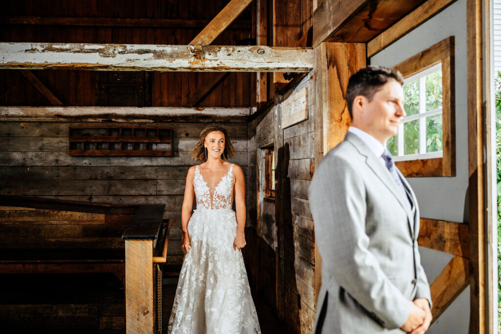 Bride approaching the groom during their first look 