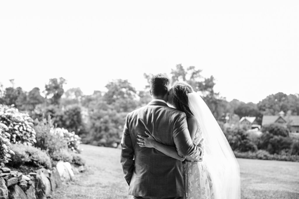 Bride and groom hugging after their wedding ceremony