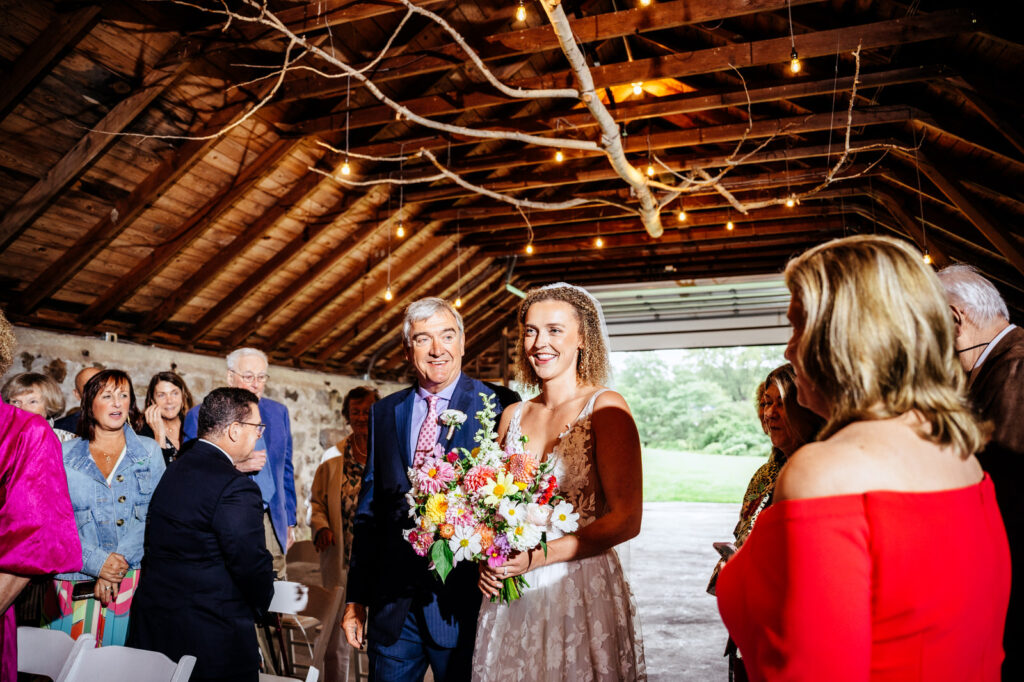 Father of the bride walking his daughter down the aisle