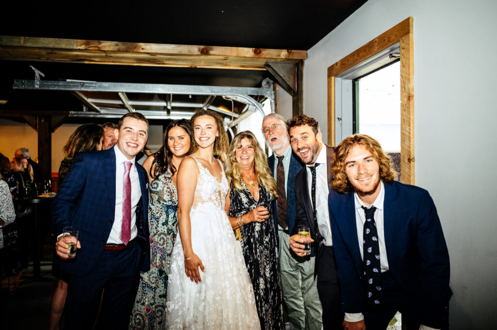 Group photo of wedding guests with the bride