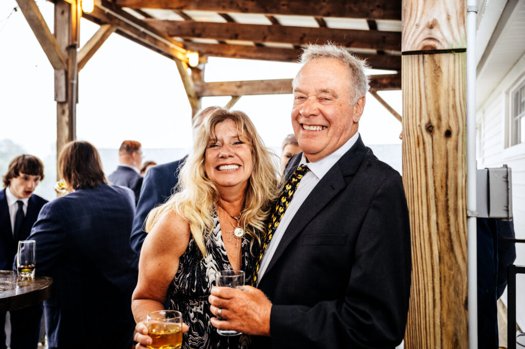 Smiling couple during cocktail hour 