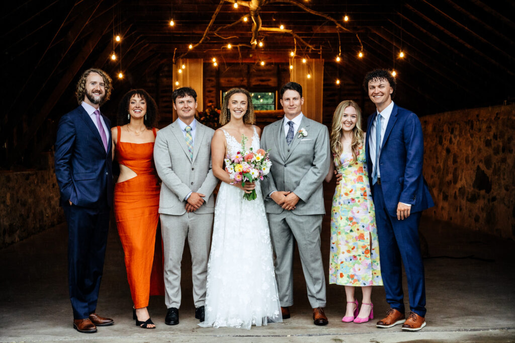 Bride, groom, and family posing together