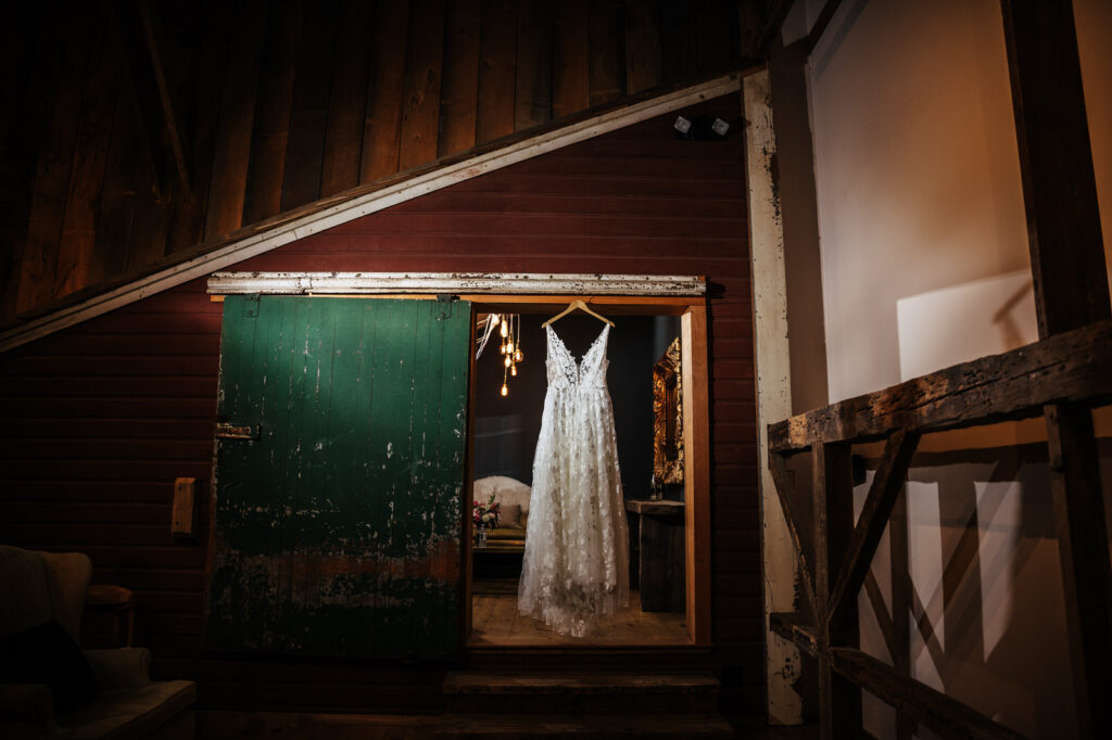 Wedding dress hanging in the loft at South Farms