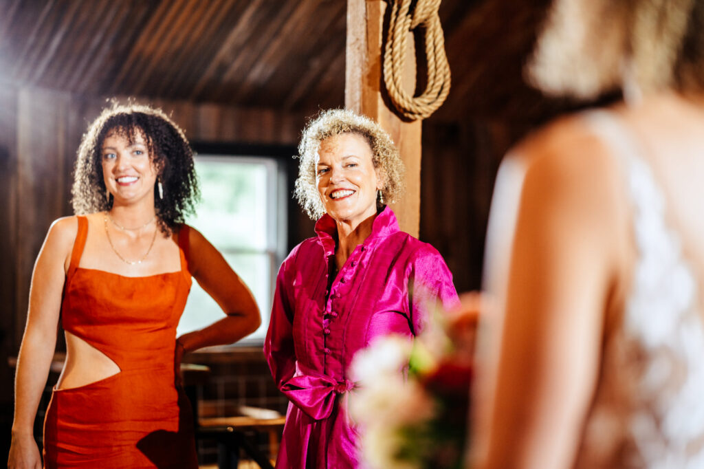 Mother smiling at the bride