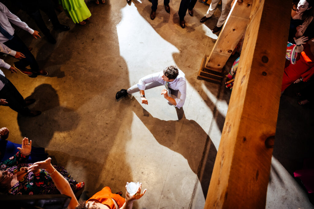 Overhead shot of guest dancing during the wedding reception