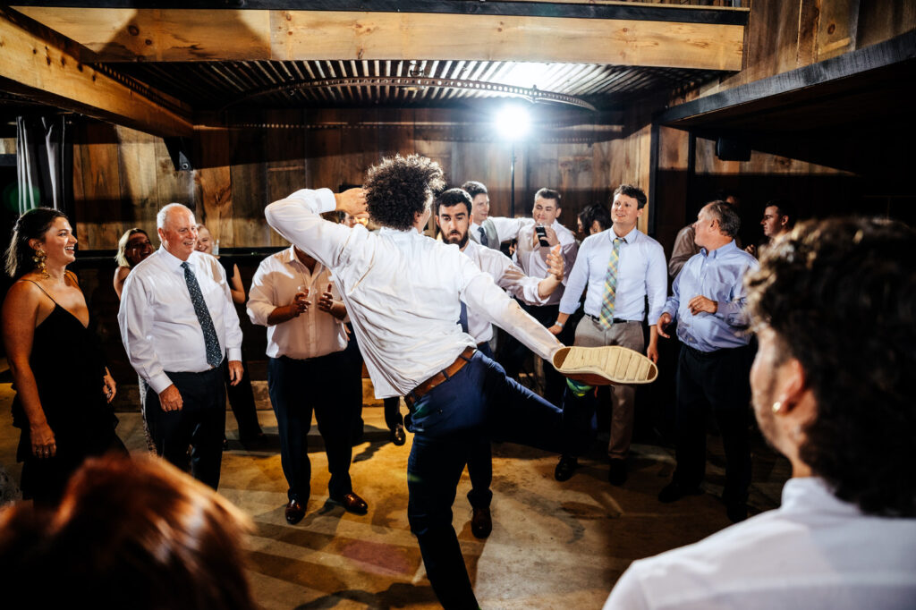 Man dancing during wedding reception