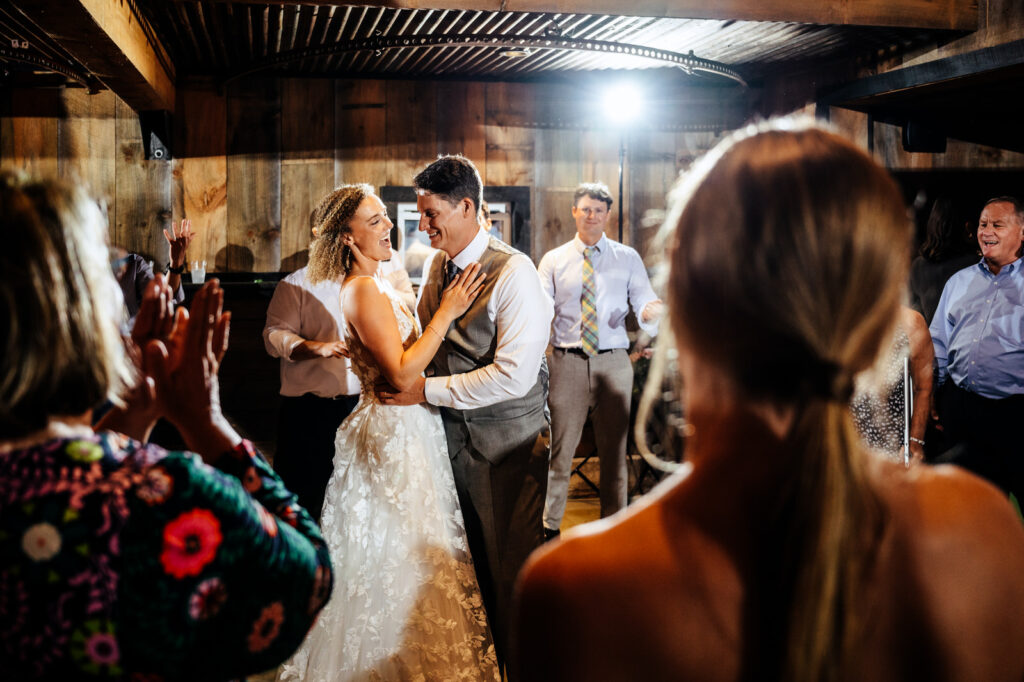 Bride and groom dancing and laughing together