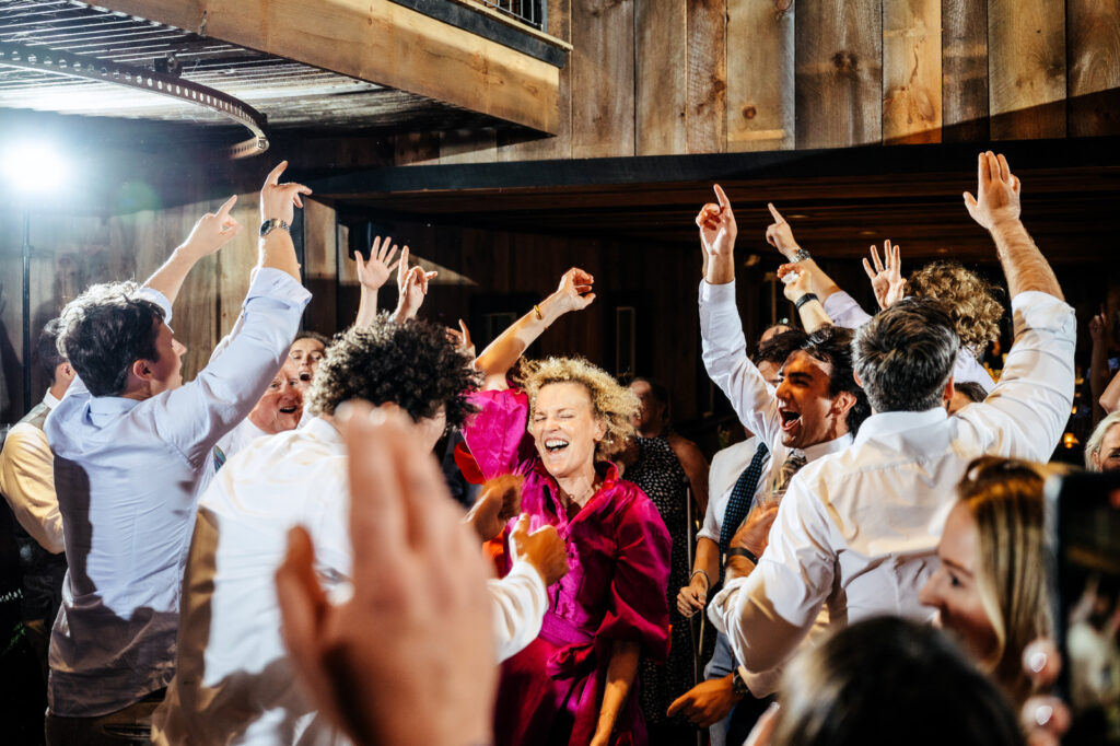 Brides mother dancing with guests