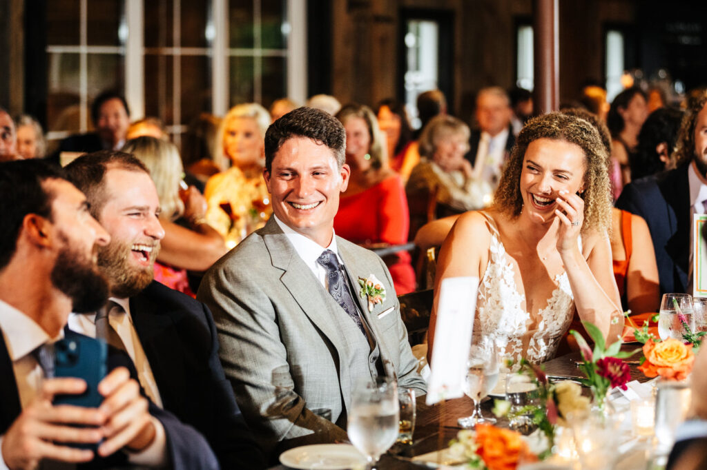 Happy bride and groom during a speech