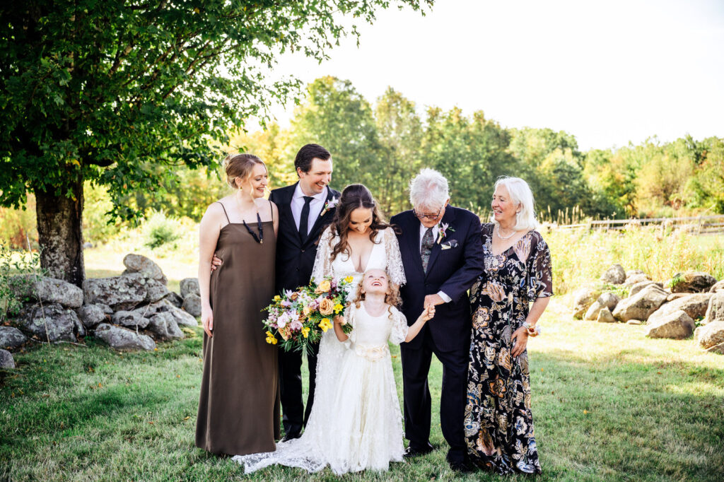 Family smiling and laughing during family photos 