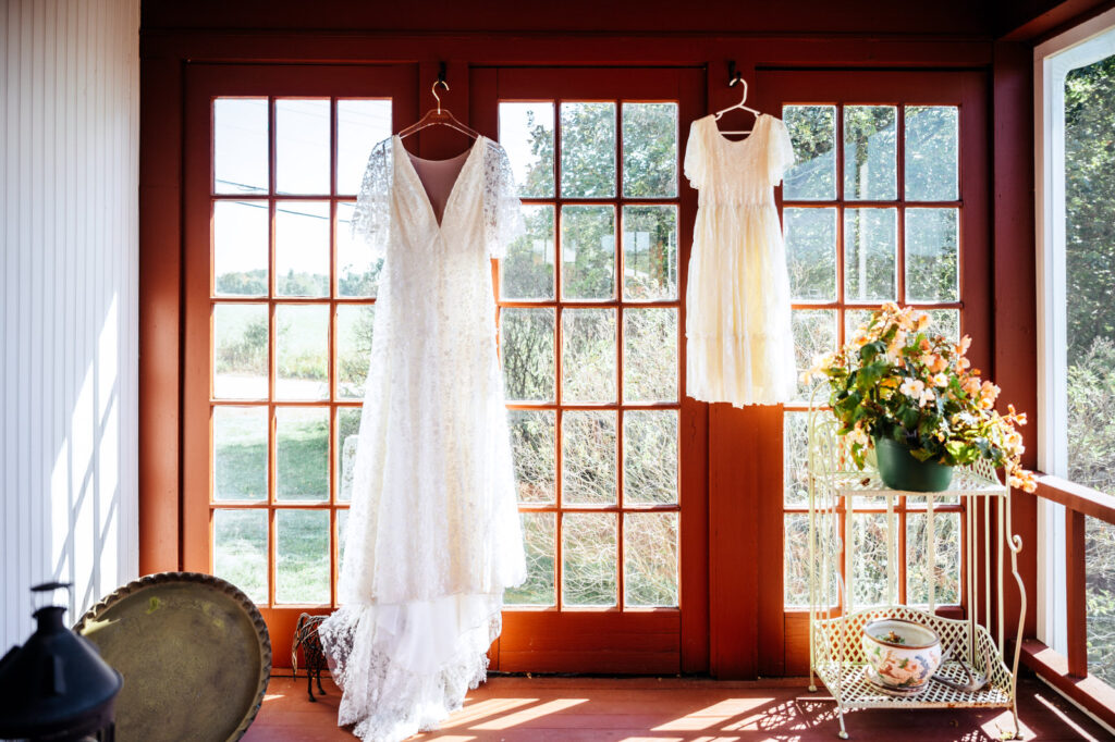 Bride and her daughter's dresses hanging