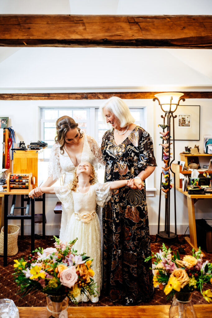 Bride, mother, daughter getting ready