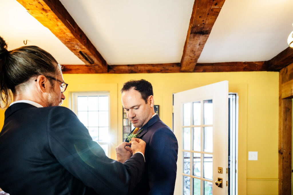 Groom getting ready with a friend
